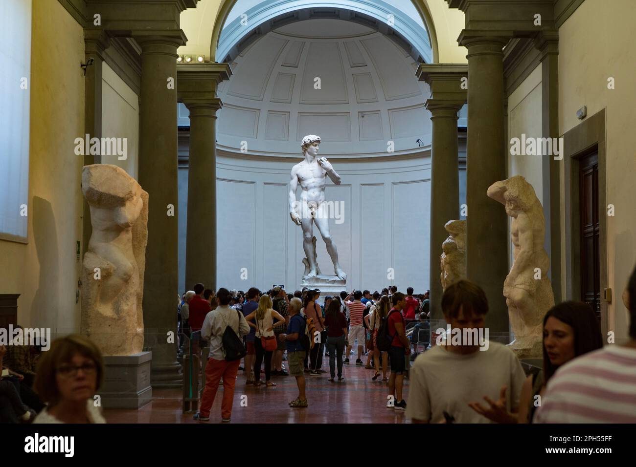 Florence, Italy - Jun 17, 2014: Tourist visit the Accademia Gallery, home to the masterpiece of Renaissance sculpture David, created in marble between Stock Photo