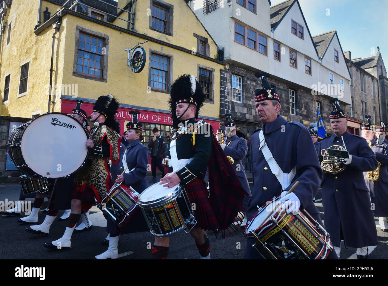 Edinburgh Scotland, UK 26 March 2023. The inaugural The Royal Regiment of Scotland SCOTS Rally takes place with both serving and veterans mustering at Edinburgh Castle and marching down the Royal Mile behind the Pipes and Drums to the Canongate Kirk to remember the fallen. credit sst/alamy live news Stock Photo