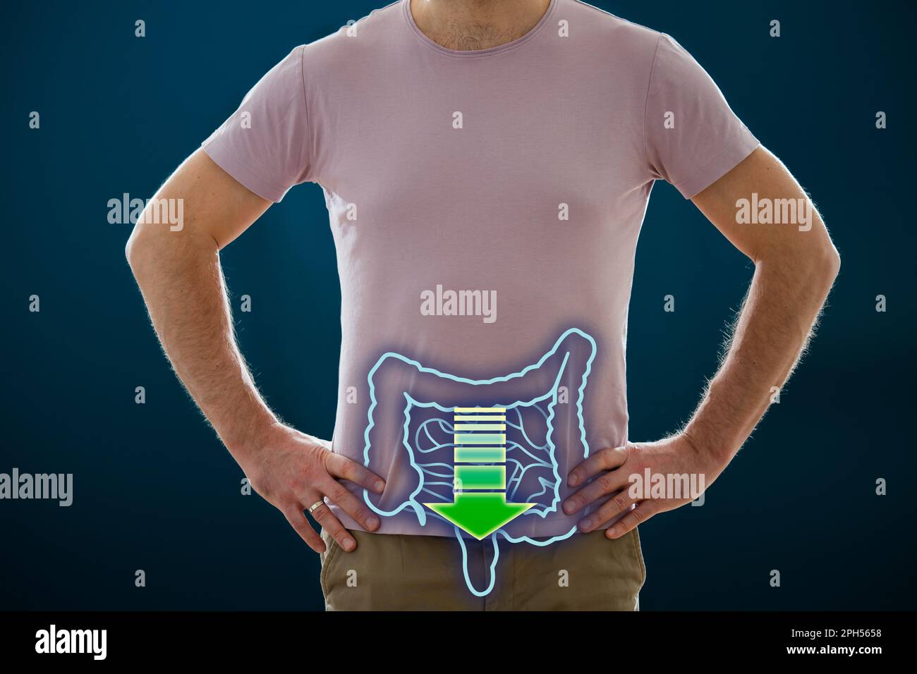 The man standing on a dark background. Picture of a human digestive