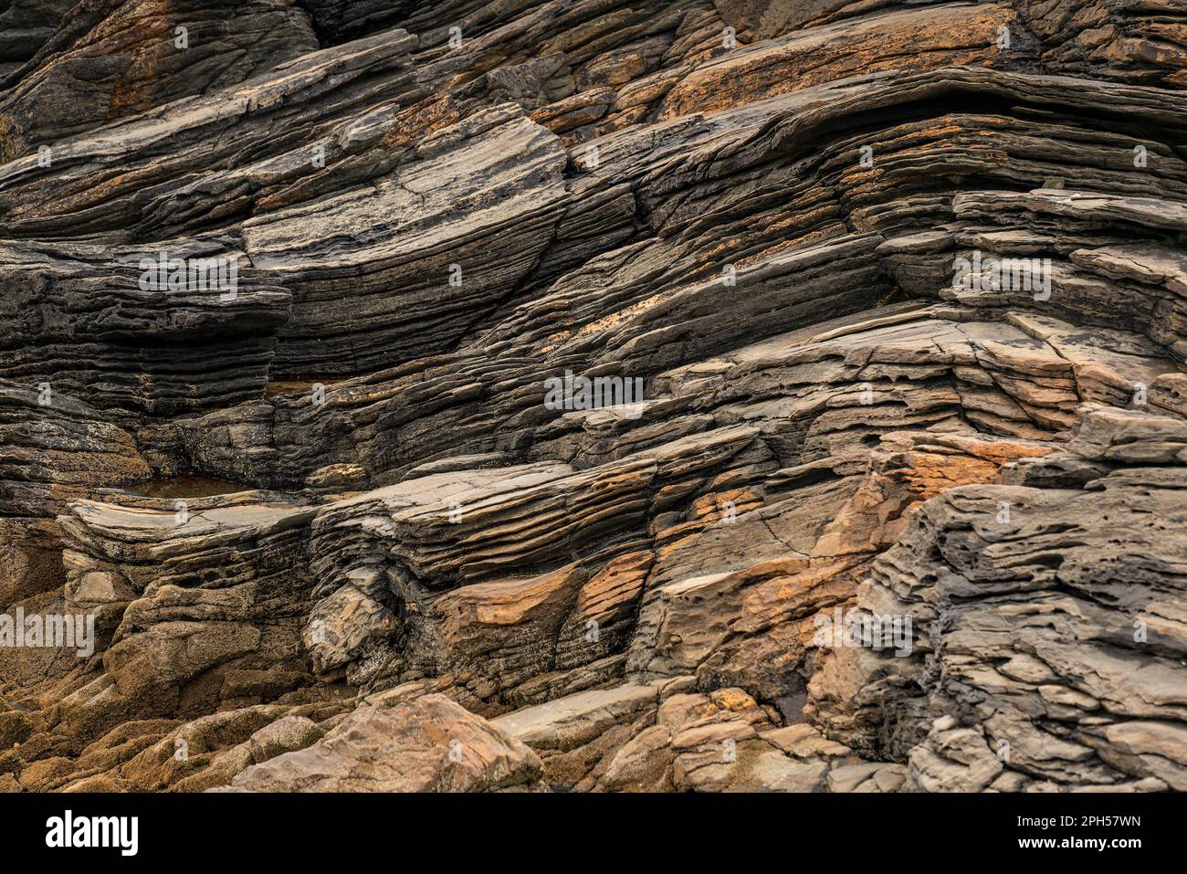 Full frame shot of the bizarre layered rocks near Tramore beach, Kiltoorish, County Donegal, Ireland Stock Photo