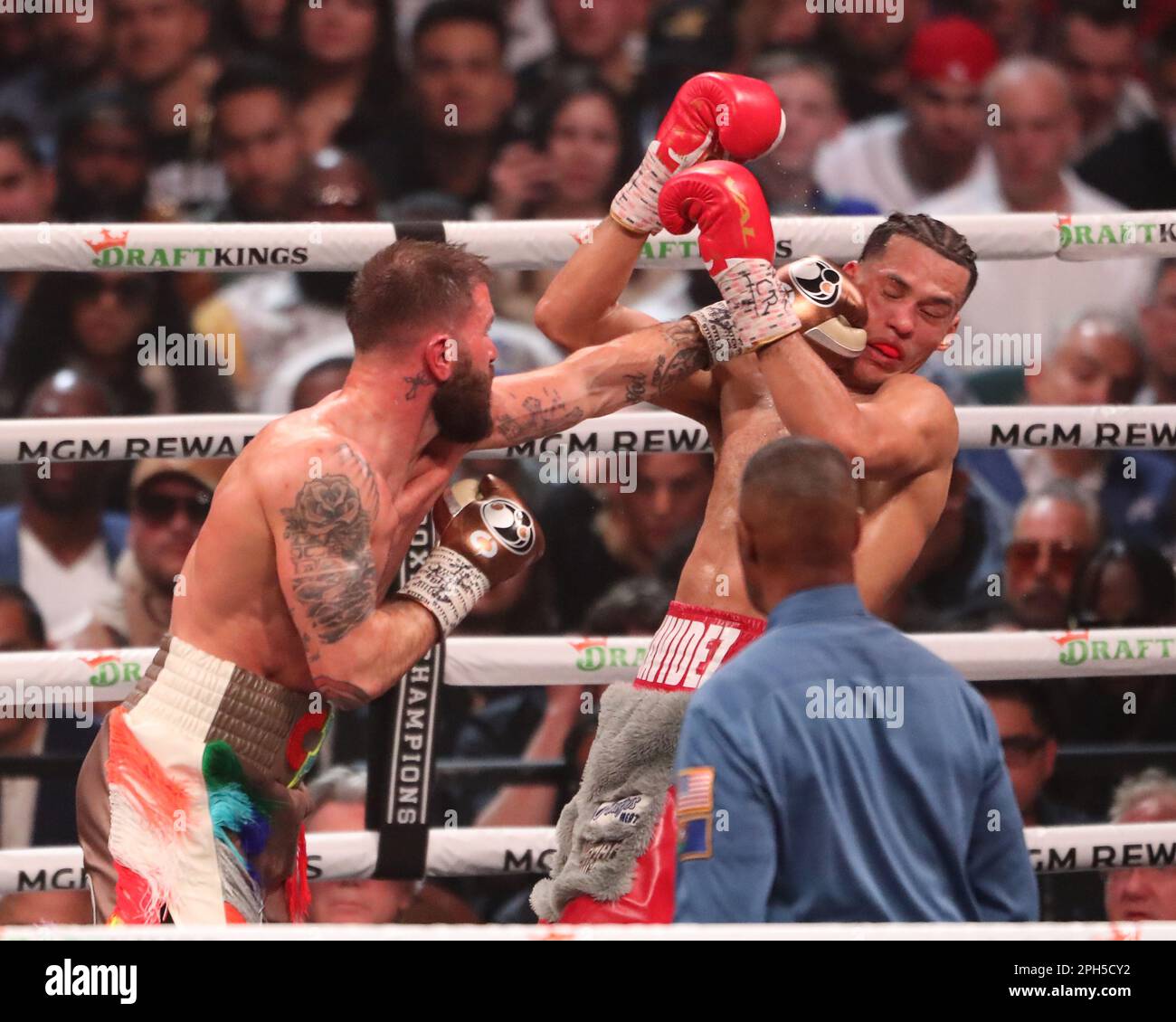 LAS VEGAS, NV - MARCH 25: (L-R) Caleb Plant punches David Benavidez in ...