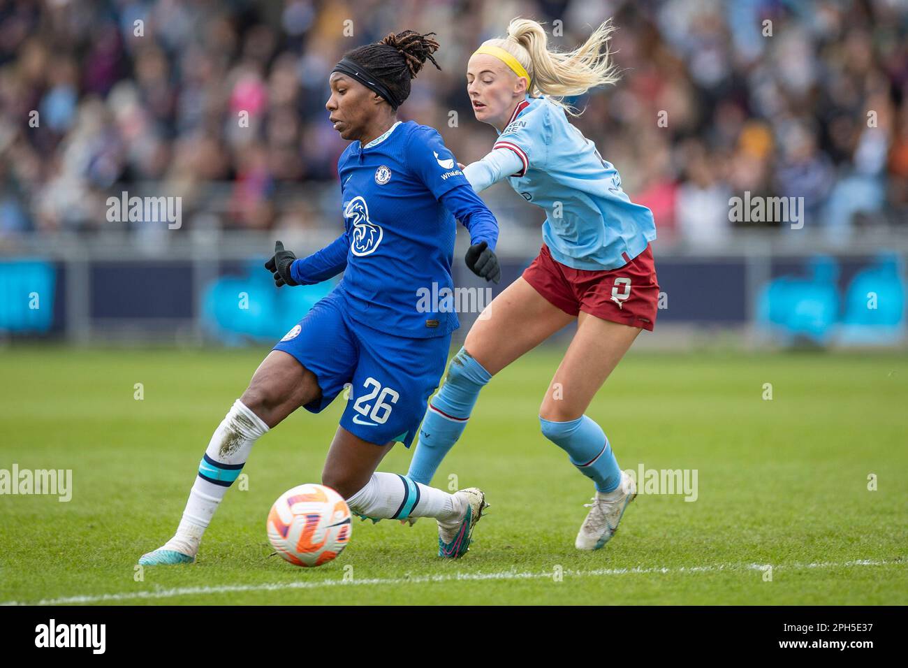 Manchester on Sunday 26th March 2023. Kadeisha Buchanan #26 (GK)of Chelsea  F.C] tackled by Alex Greenwood #5 of Manchester City during the Barclays FA  Women's Super League match between Manchester City and
