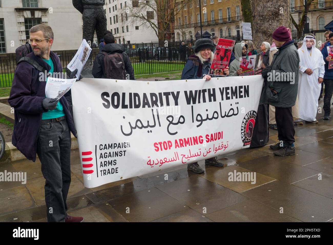 London, UK. 26 Mar 2023. 8 years after the start of the brutal assault on Yemen by Saudi-led forces people stand in a vigil at Downing St organised by CAAT for the thousands who have died, and call for the UK to stop supplying arms. The UN estimates that more than 377,000 had died by the end of 2021 and the UK has supplied arms worth over £23 billion. Peter Marshall/Alamy Live News Stock Photo