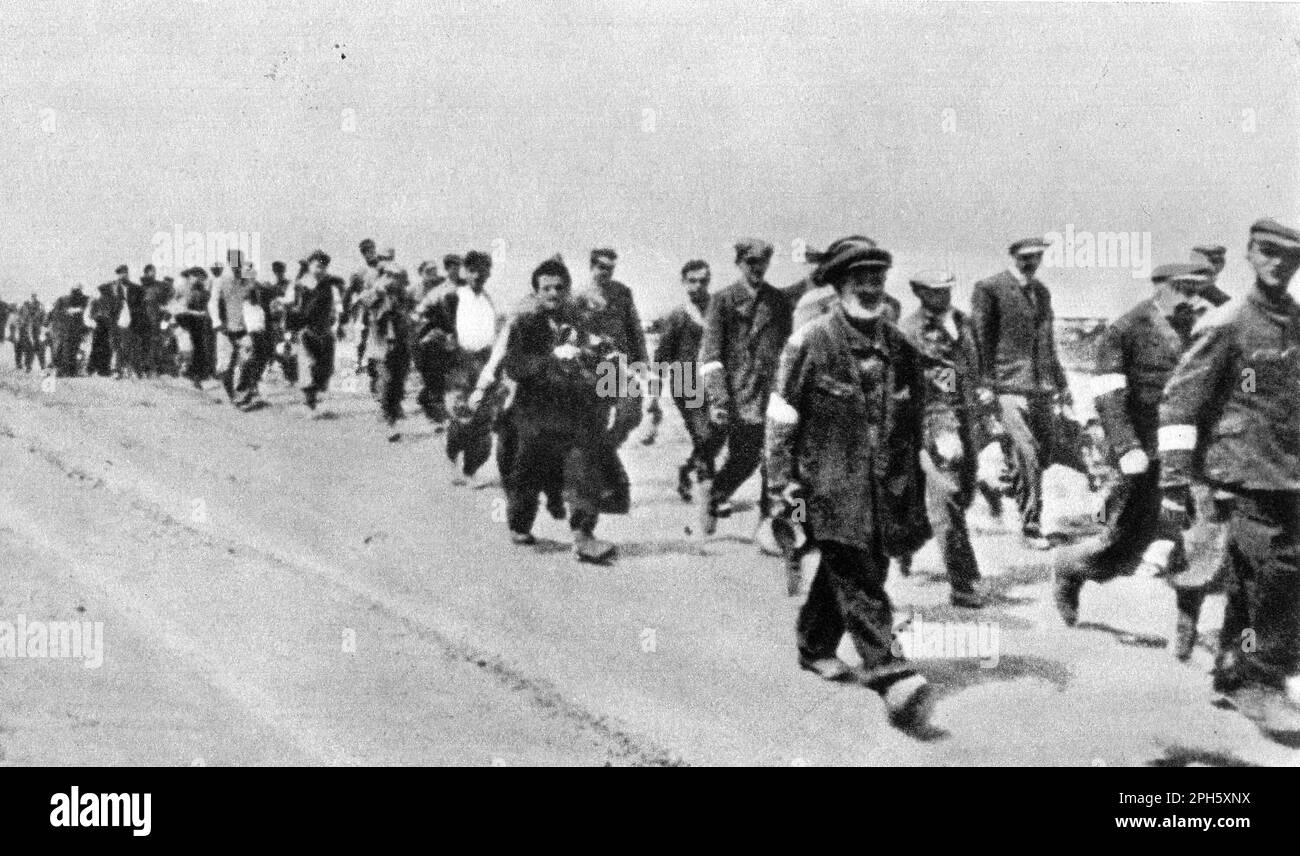 A group of Jews driven on foot to Belzec death camp.Belzec was an extermination centre built to murder the Jews of Lublin and Lwow. About 450,000 people were killed there before it was closed and eradicated in 1943. Very few photos of it exist as its operation was secret and it closed before the allies came so there are no post liberation images such as we see from Dachau and Auschwitz. Only 7 people survived Belzec. Stock Photo