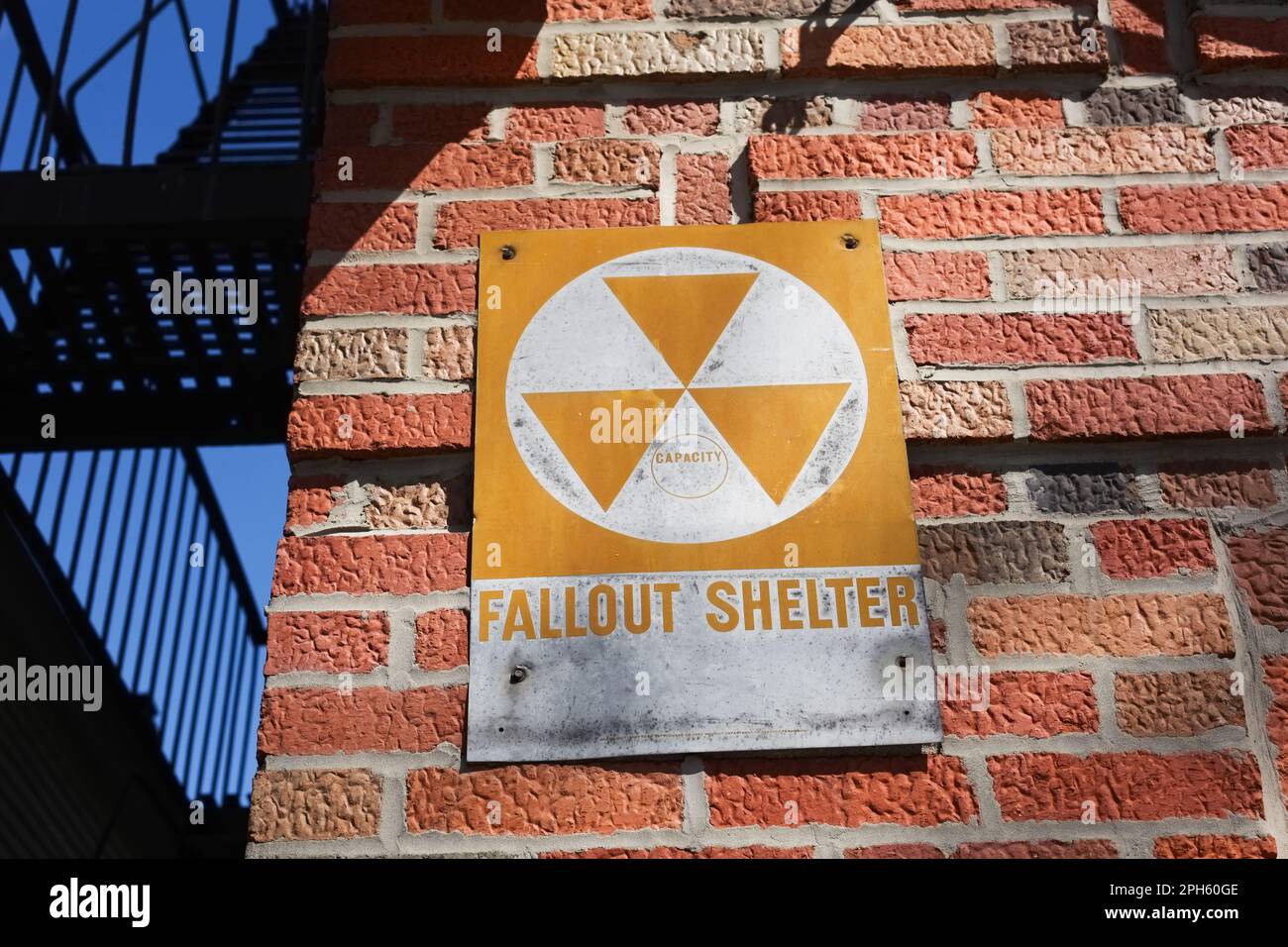 Classic nuclear radiation symbol on New York City building fallout shelter Stock Photo