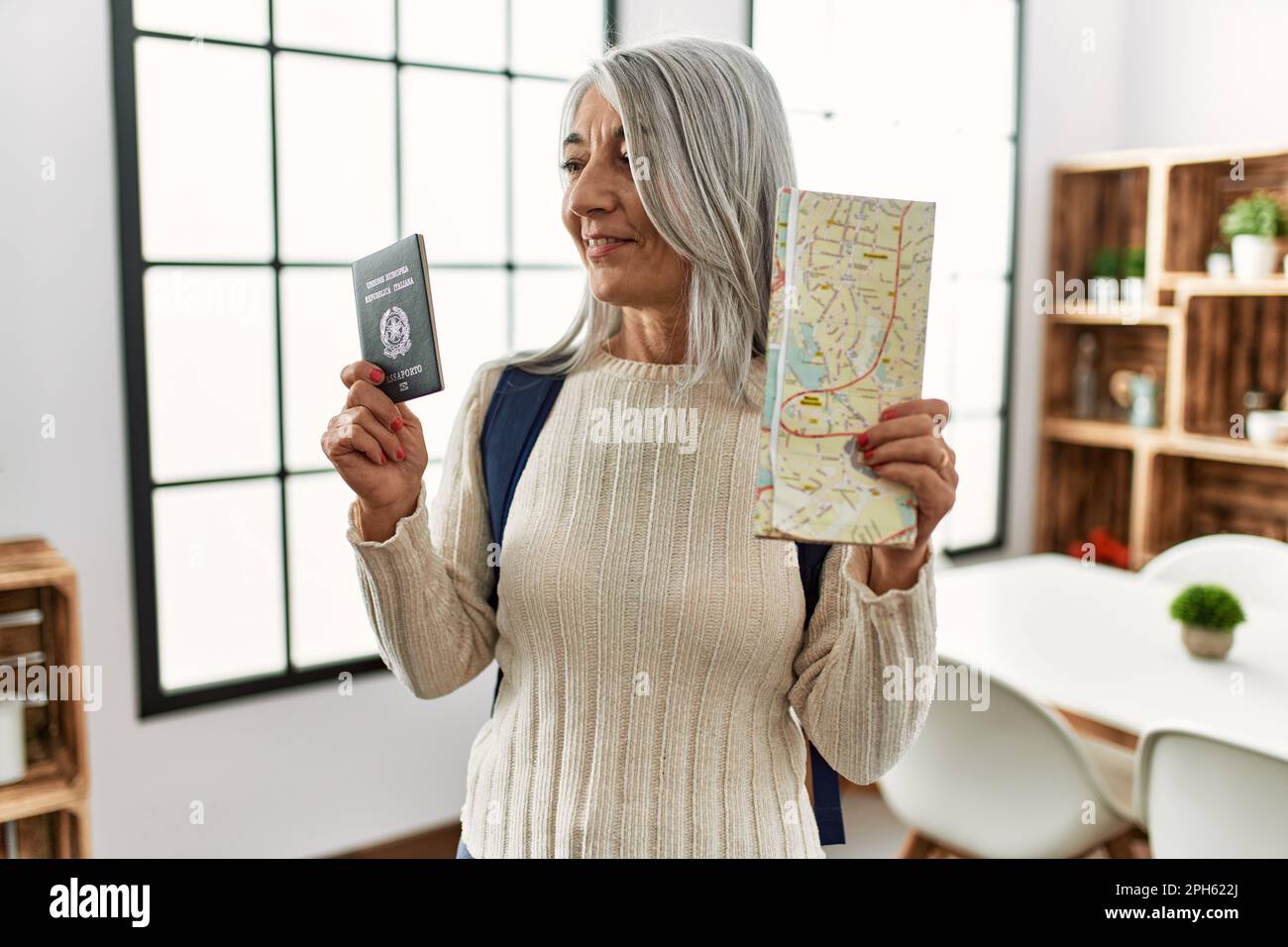 Mature woman passport map hi-res stock photography and images - Alamy