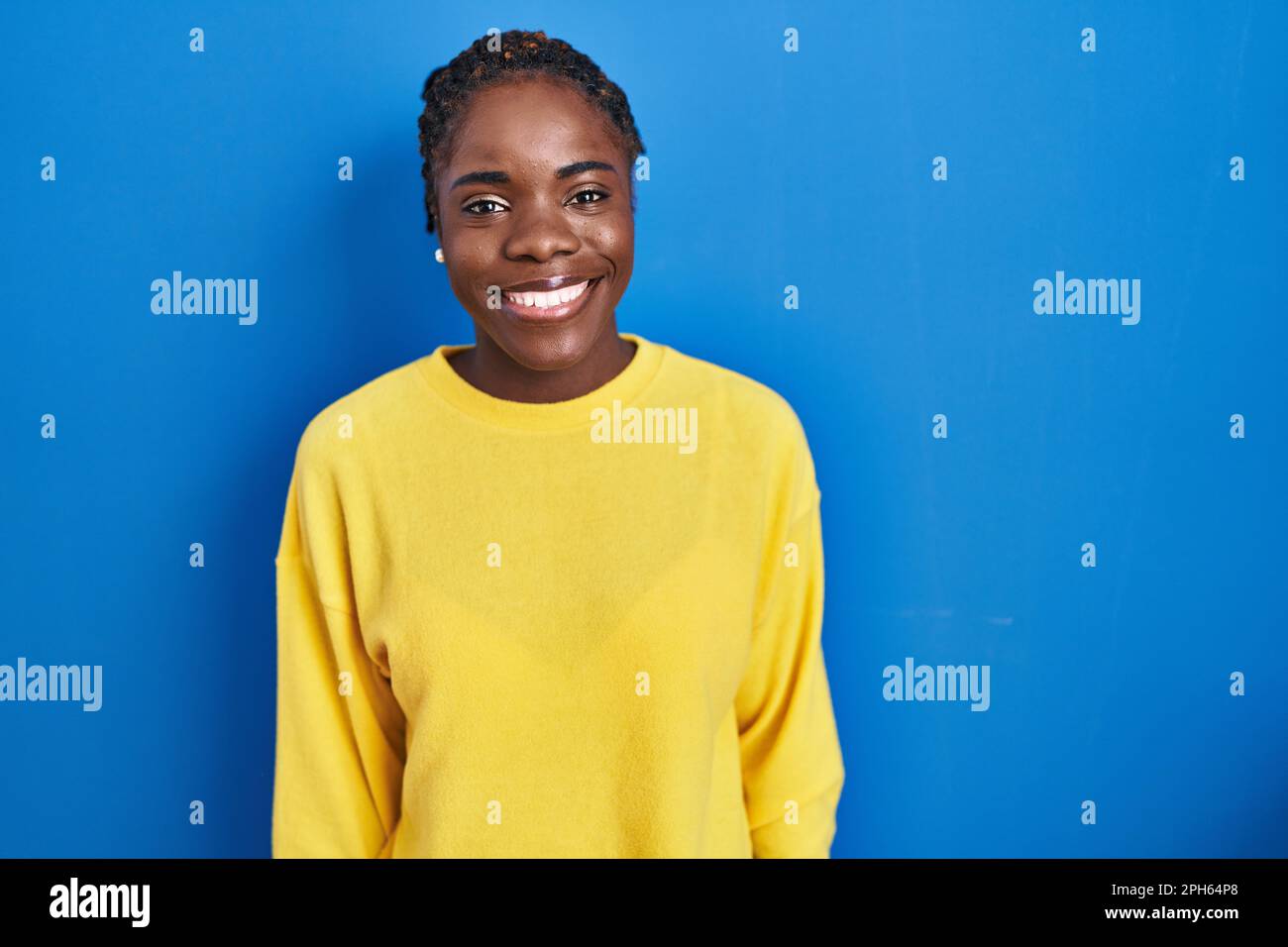 Beautiful Black Woman Standing Over Blue Background With A Happy And Cool Smile On Face Lucky 0514