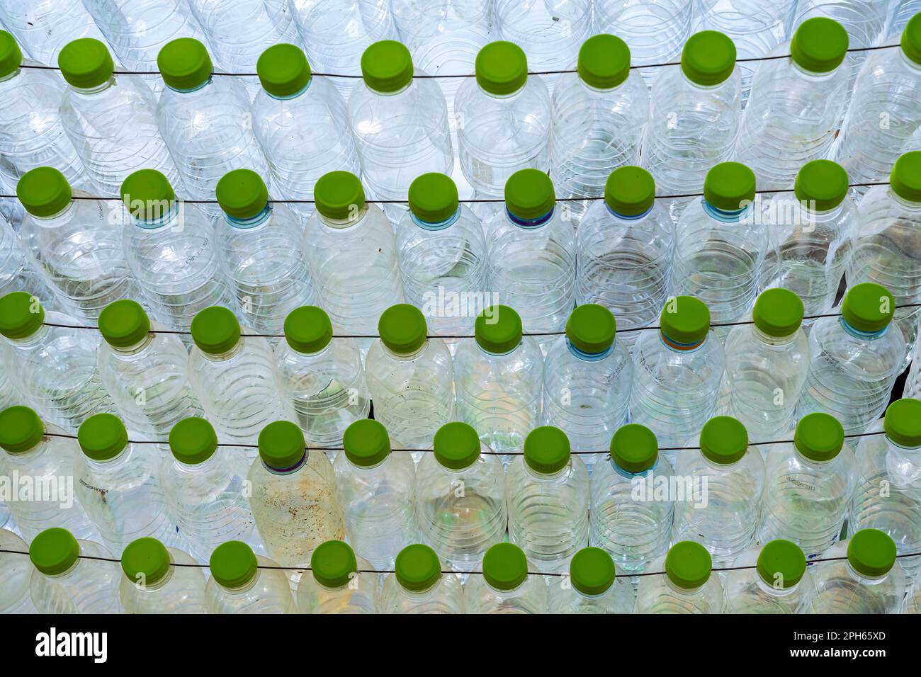 Beautiful wall made of multi colored recycled plastic bottles. Bottle