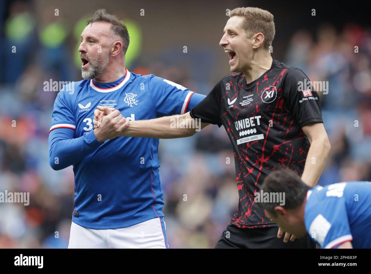 Rangers Legend Kris Boyd and World Legends’ Michael Dawson during the Legends match at the Ibrox Stadium, Glasgow. Picture date: Sunday March 26, 2023. Stock Photo