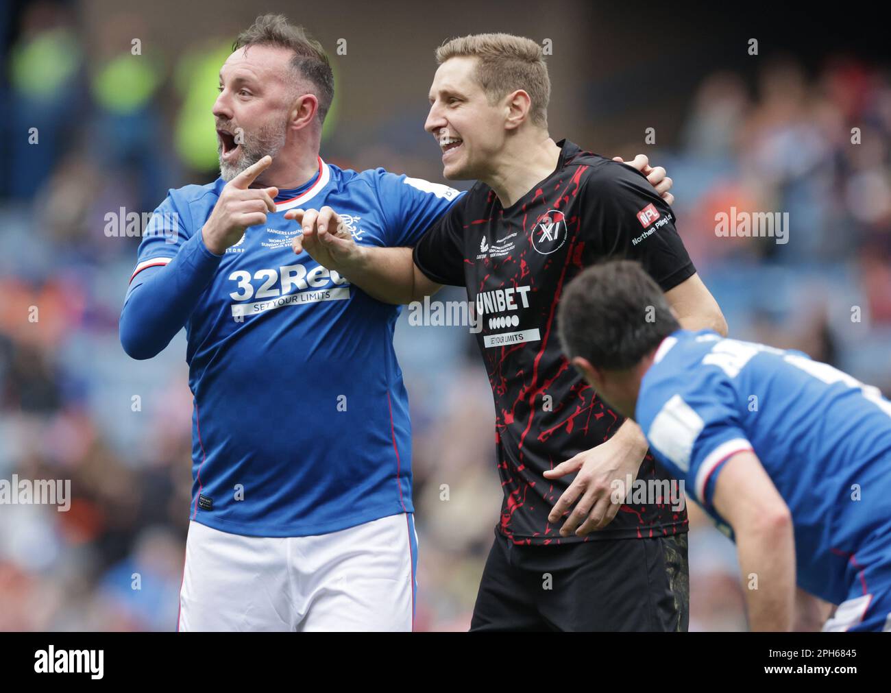 Rangers Legend Kris Boyd and World Legends’ Michael Dawson during the Legends match at the Ibrox Stadium, Glasgow. Picture date: Sunday March 26, 2023. Stock Photo