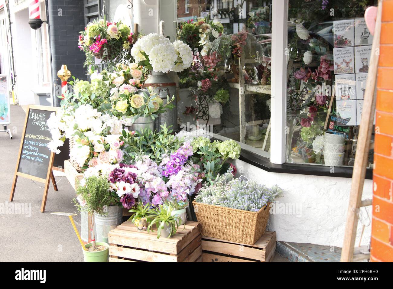 Flowers florist shop on Ashtead high street, with flowers outside on