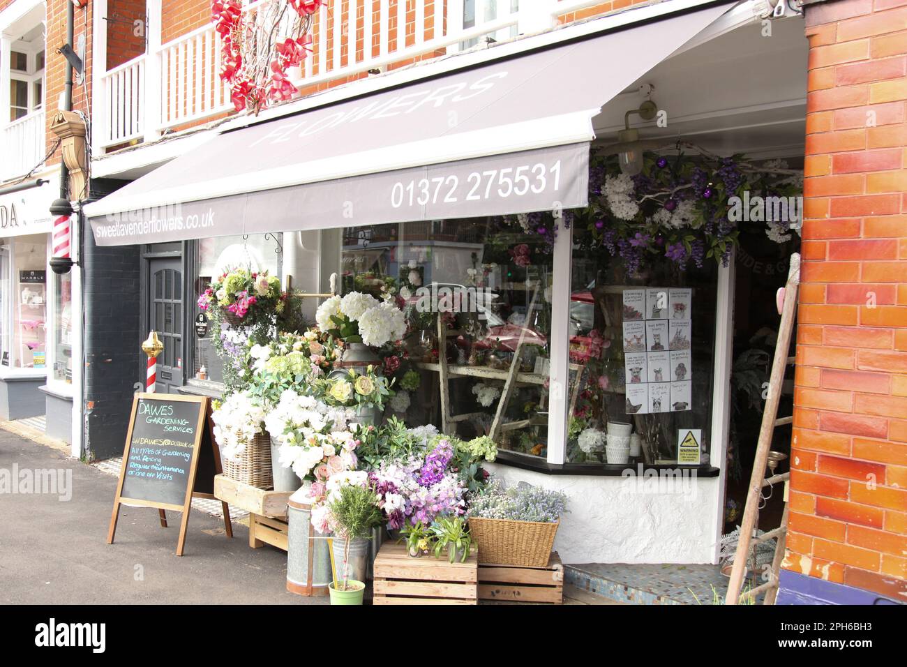 Flowers florist shop on Ashtead high street, with flowers outside on