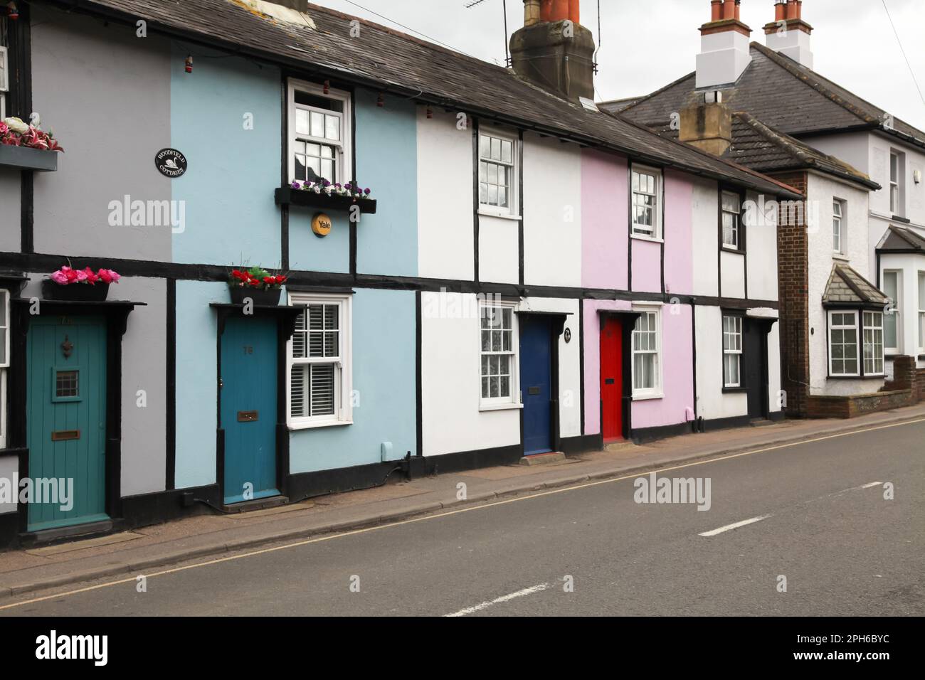 The colourful Woodfield Lane cottages in Ashtead, Surrey, England, UK