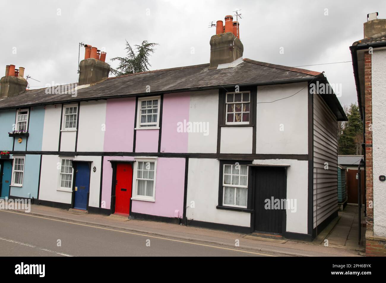 The colourful Woodfield Lane cottages in Ashtead, Surrey, England, UK