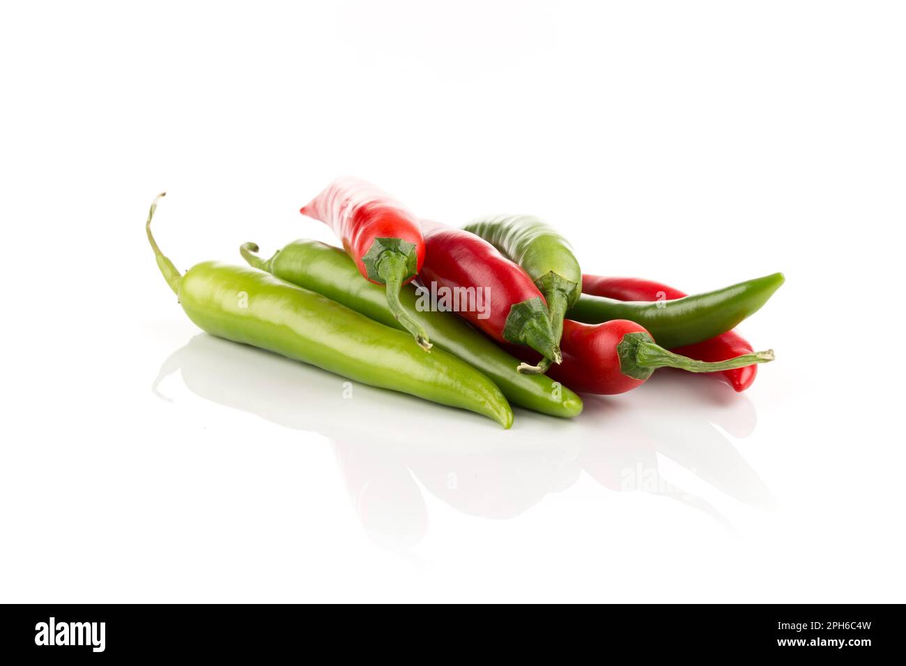 Green and red chili pepper isolated on white background Stock Photo - Alamy