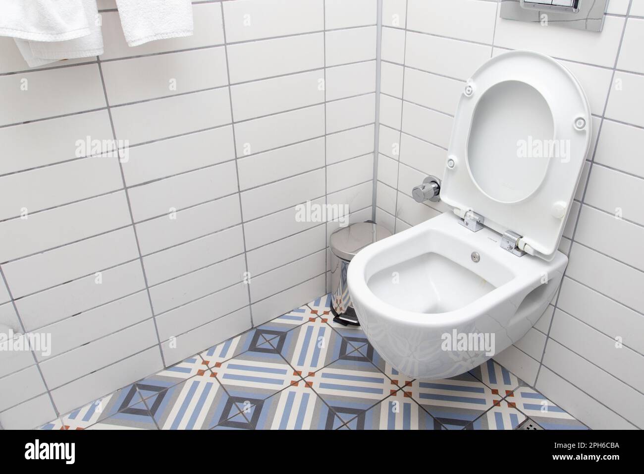 Floating toilet. Mounted toilet bowl in clean modern bathroom Stock