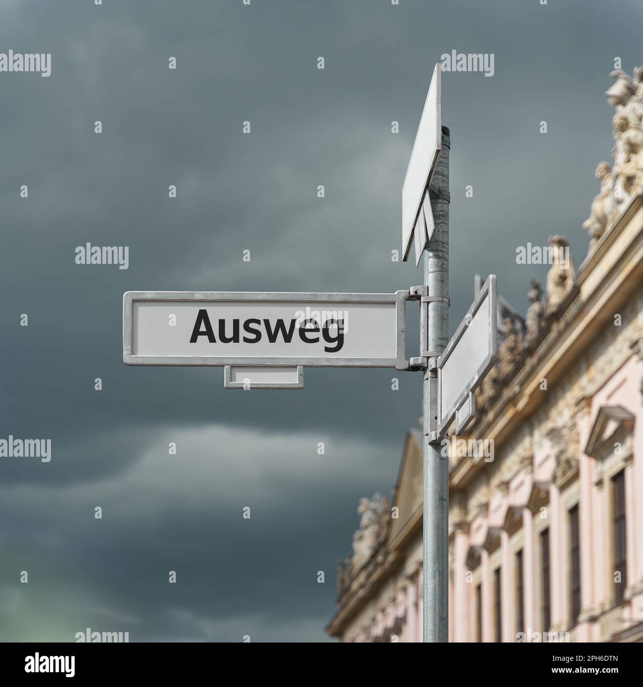 Road sign with the german inscription Ausweg for the way out of the crisis. Translation: way out Stock Photo