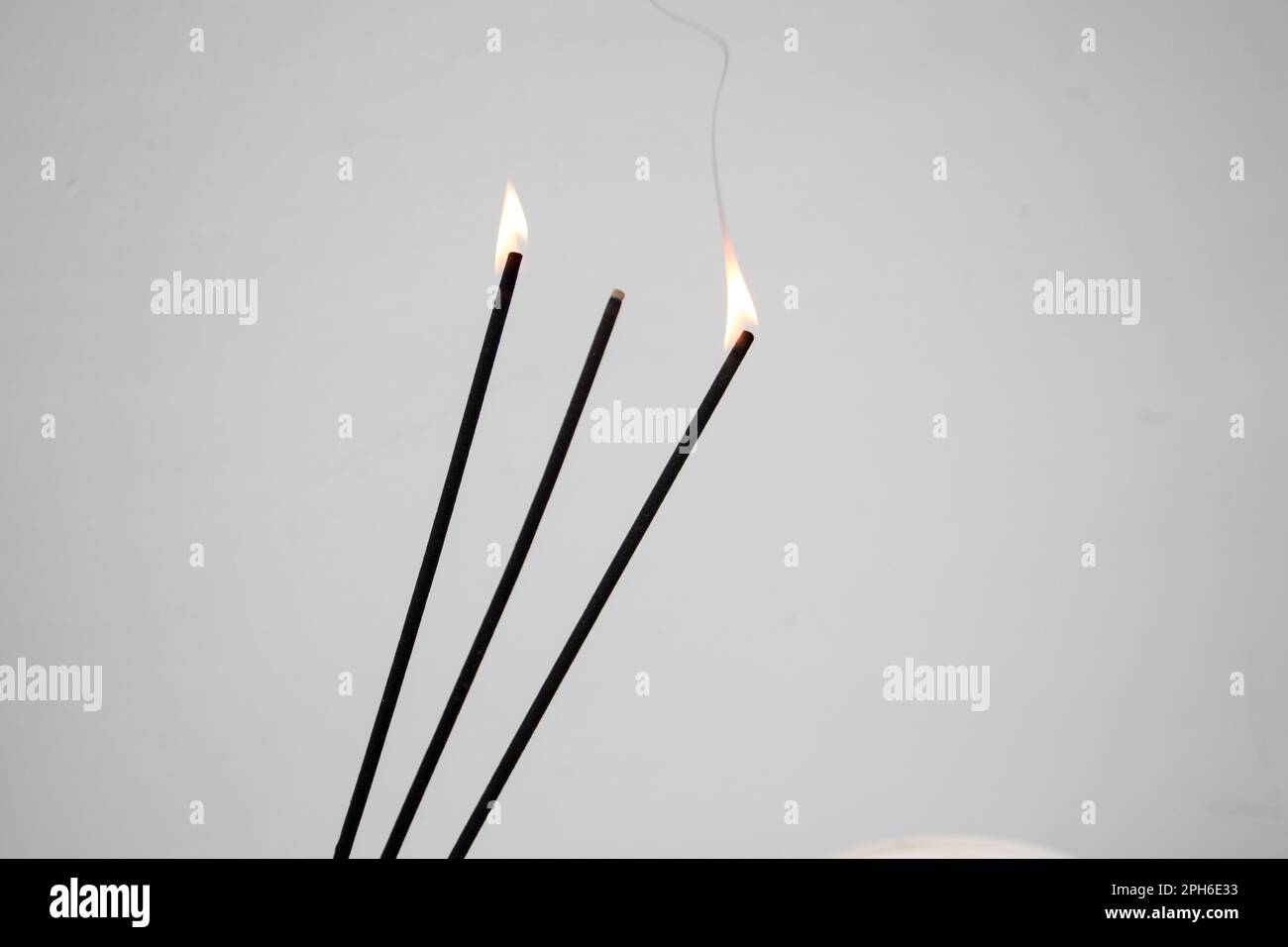 Burning aroma Incense sticks on white background Stock Photo - Alamy