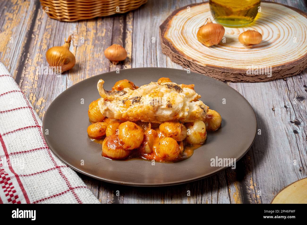 Traditional greek stifado with cod fish Stock Photo Alamy