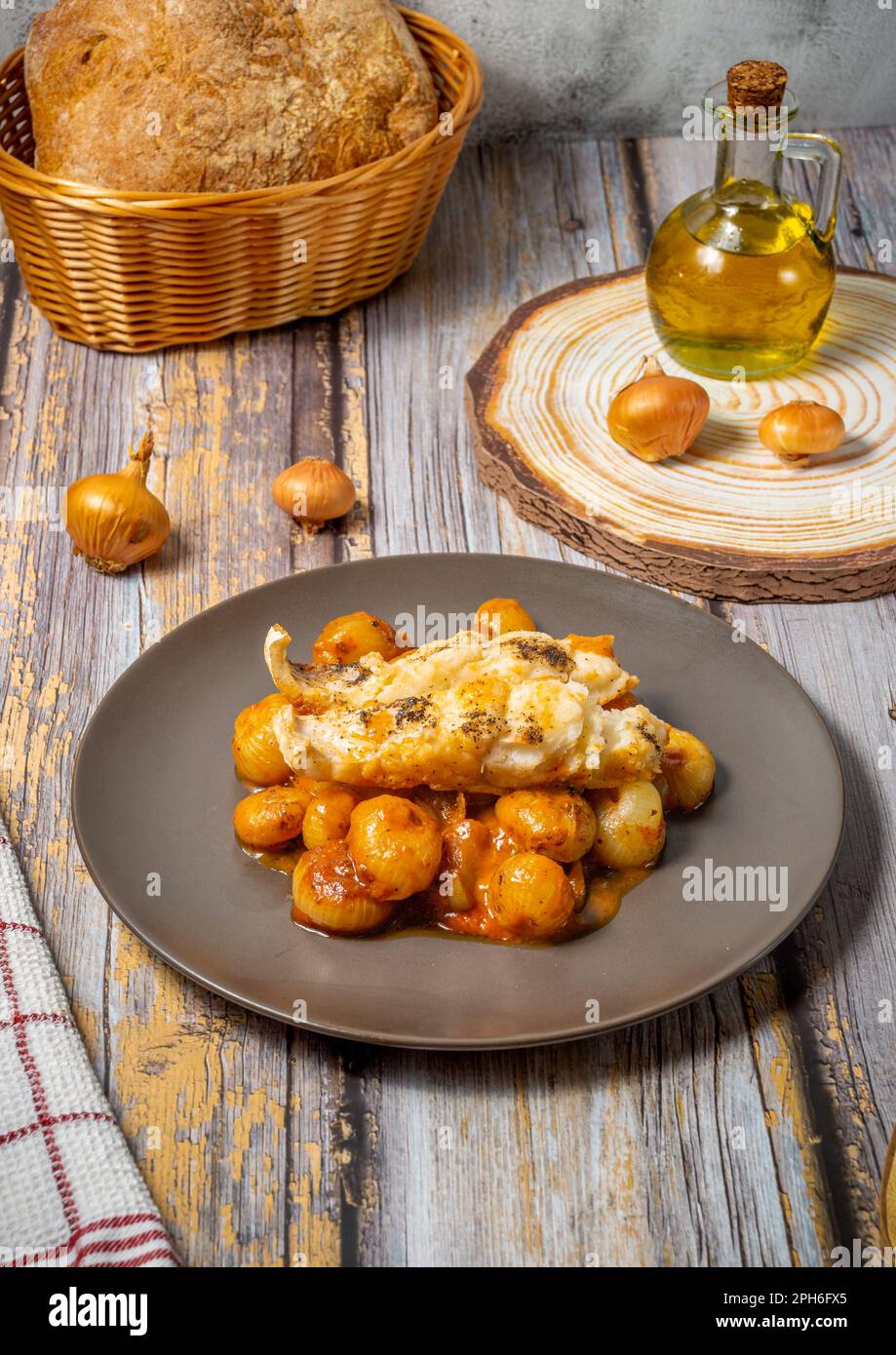 Traditional greek stifado with cod fish Stock Photo Alamy