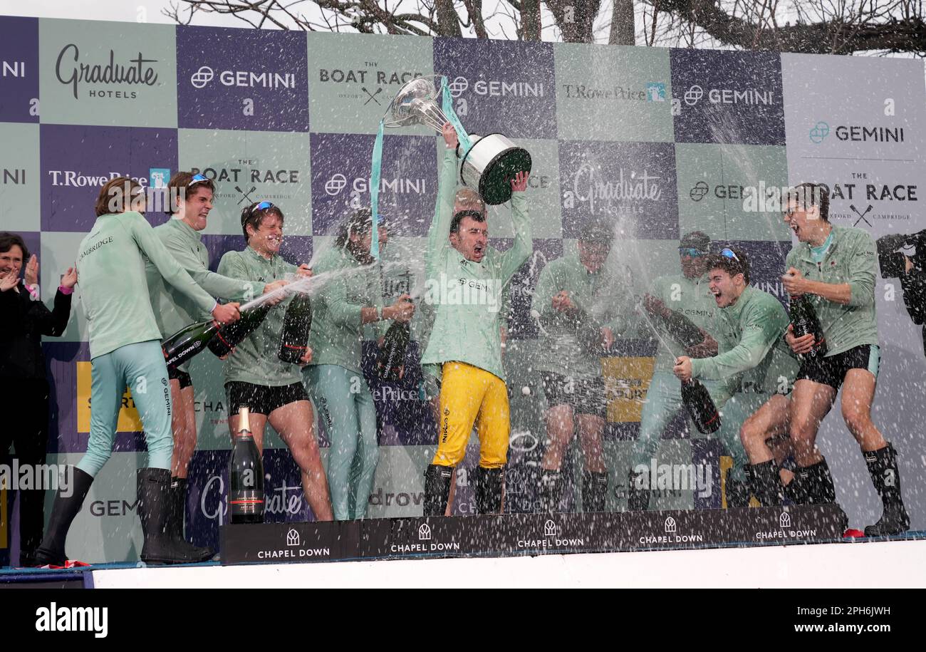 Cambridge President Ollie Boyne lifts the trophy after the 168th Men's Gemini Boat Race 2023 on the River Thames, London. Picture date: Sunday March 26, 2023. Stock Photo