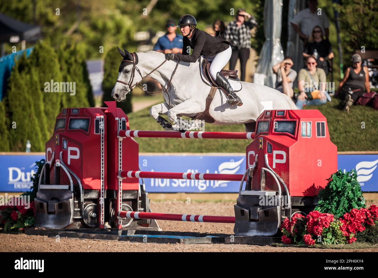 A rider competes in the Major League Show Jumping tour at Angelstone
