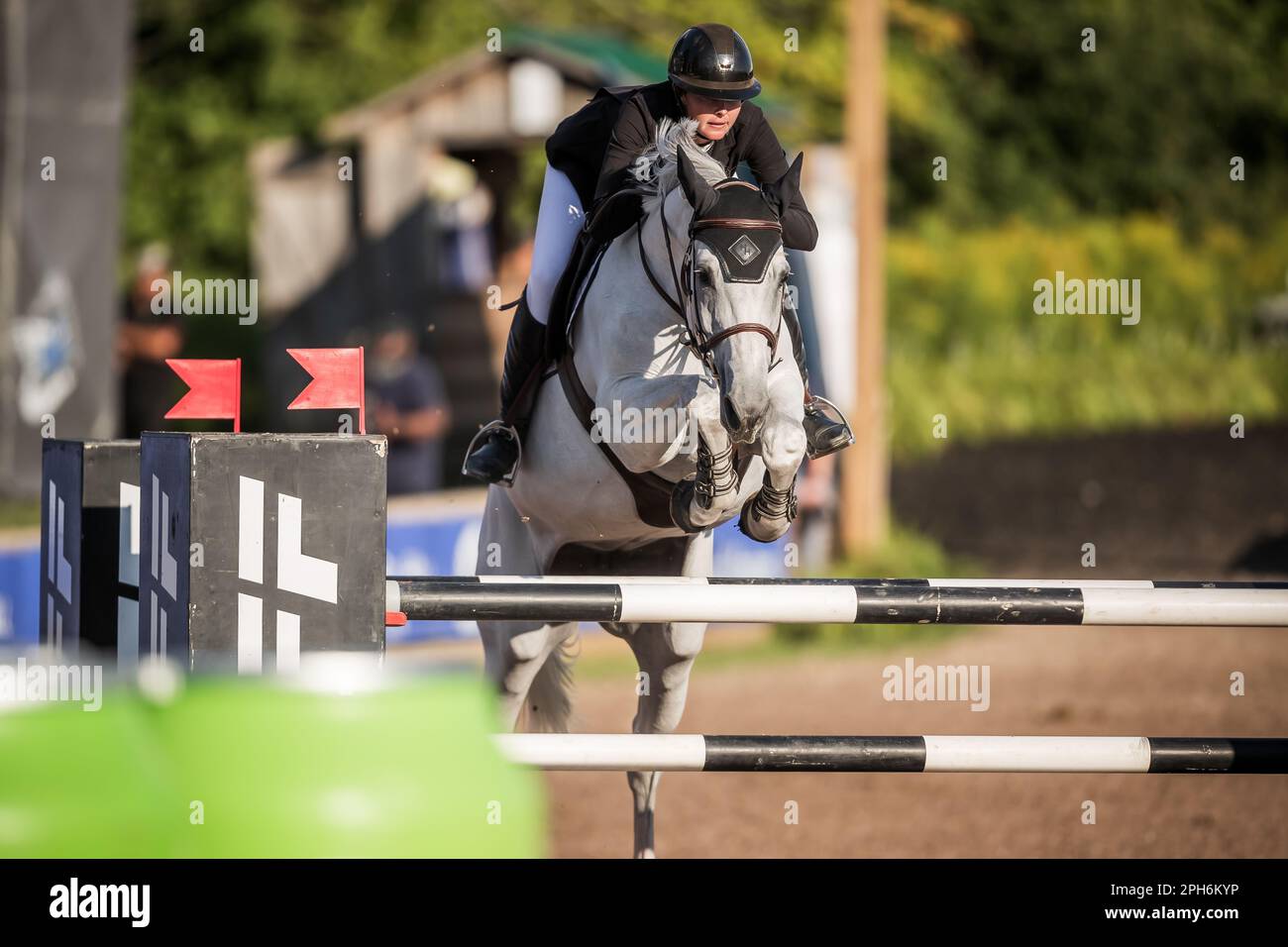 A rider competes in the Major League Show Jumping tour at Angelstone
