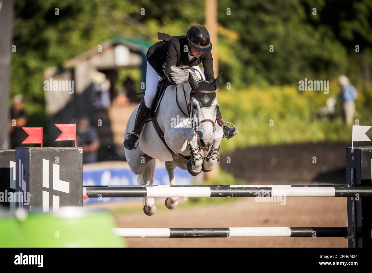 A rider competes in the Major League Show Jumping tour at Angelstone