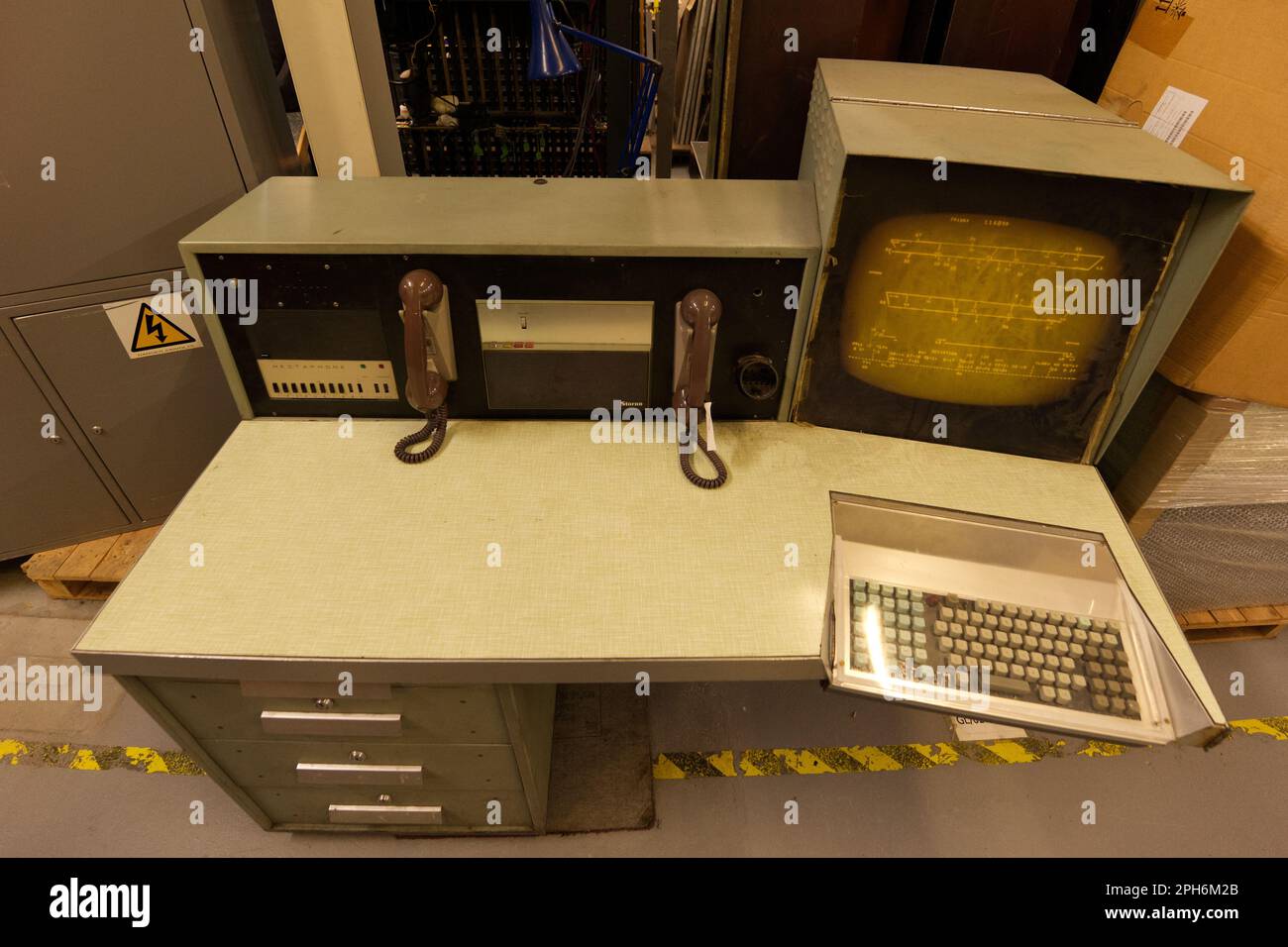 London Underground control room desk with telephones and old CRT monitor and computer Stock