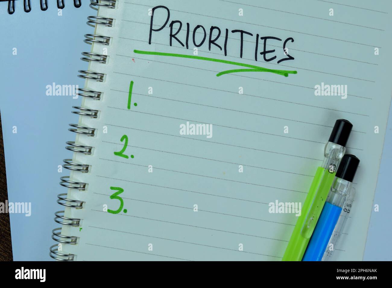 Concept of Priorities write on book. Supported by an additional ...