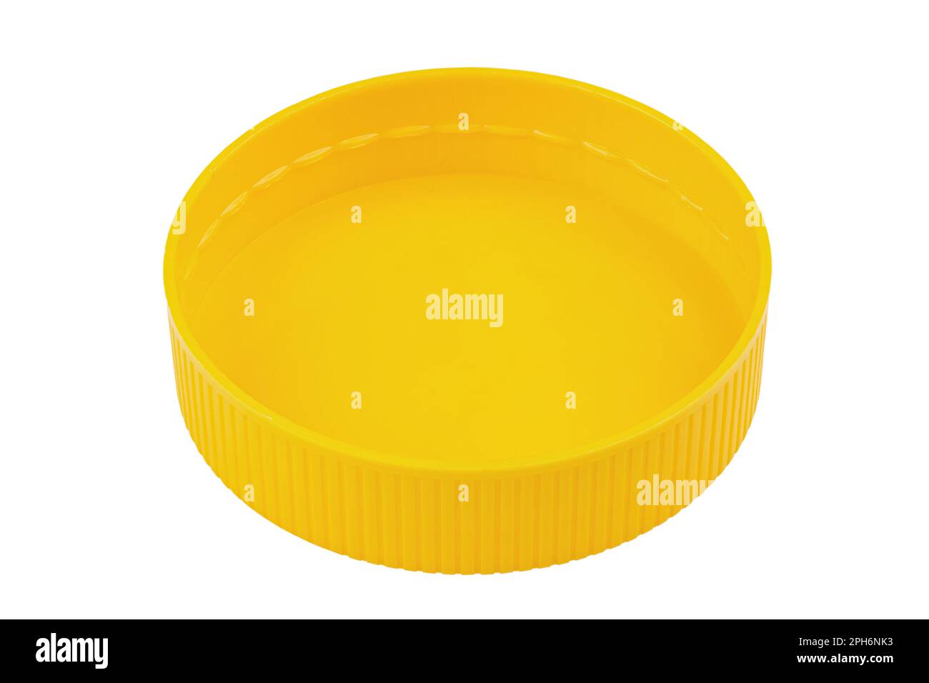 Yellow plastic lid isolated on white background. Plastic round jar lid