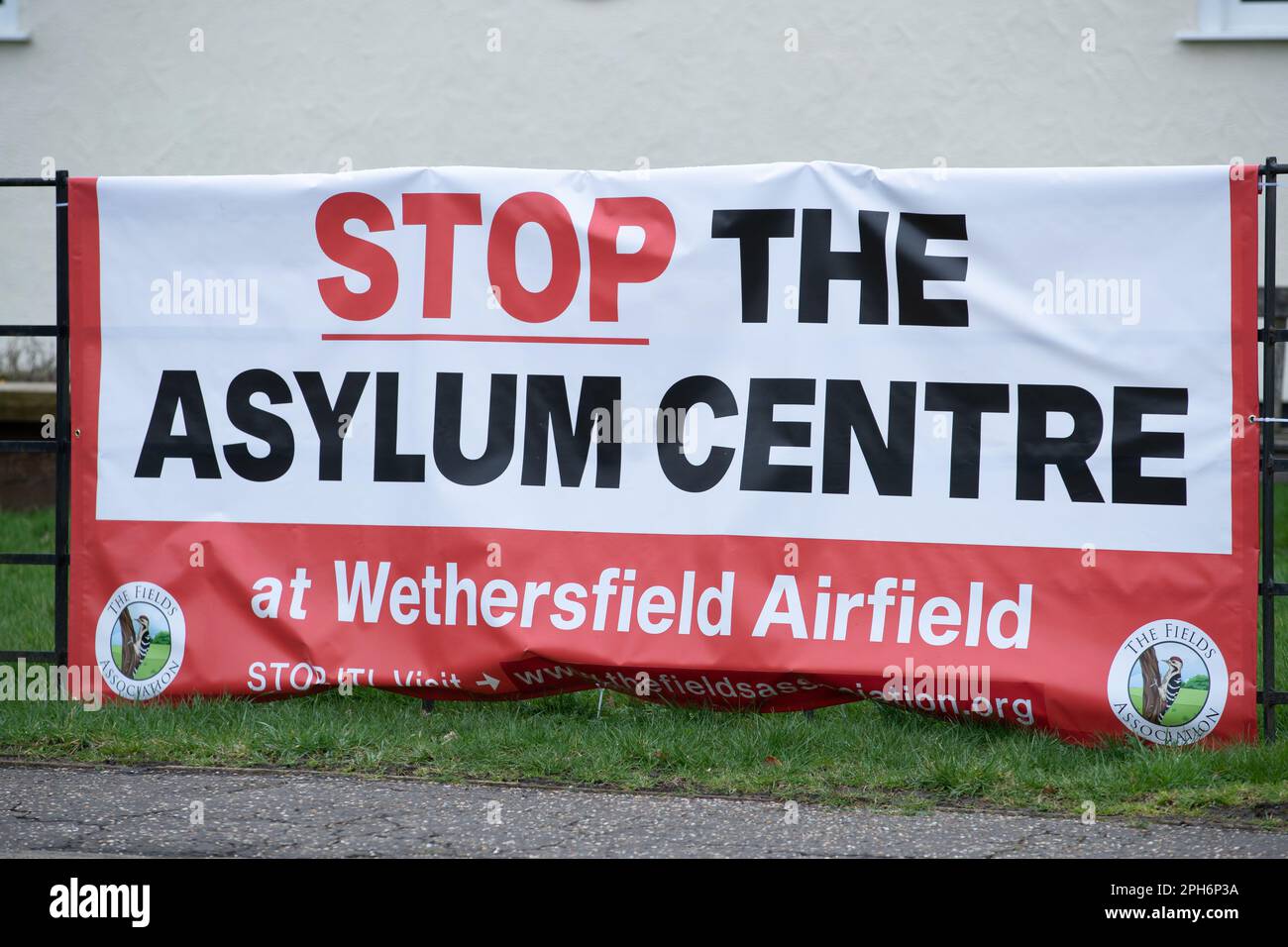 Braintree, UK. 26th Mar, 2023. 26th March 2023, A banner that says 'Stop The Asylum Centre' in Wethersfield, Braintree, Essex, MDP Wethersfield, a former RAF base is in talks to become accommodation for asylum seekers. There has been reports of the government to start using army bases and disused ferries to house migrants. Credit: Lucy North/Alamy Live News Stock Photo