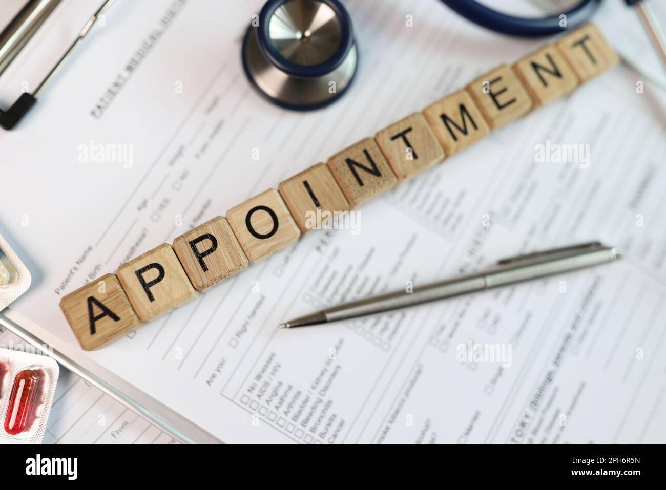 Word Appointment made with wooden cubes on medical records Stock Photo