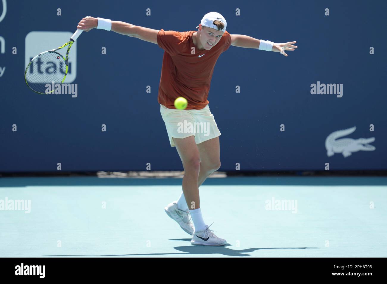 Holger Rune, of Denmark, returns a volley against Diego Schwartzman, of