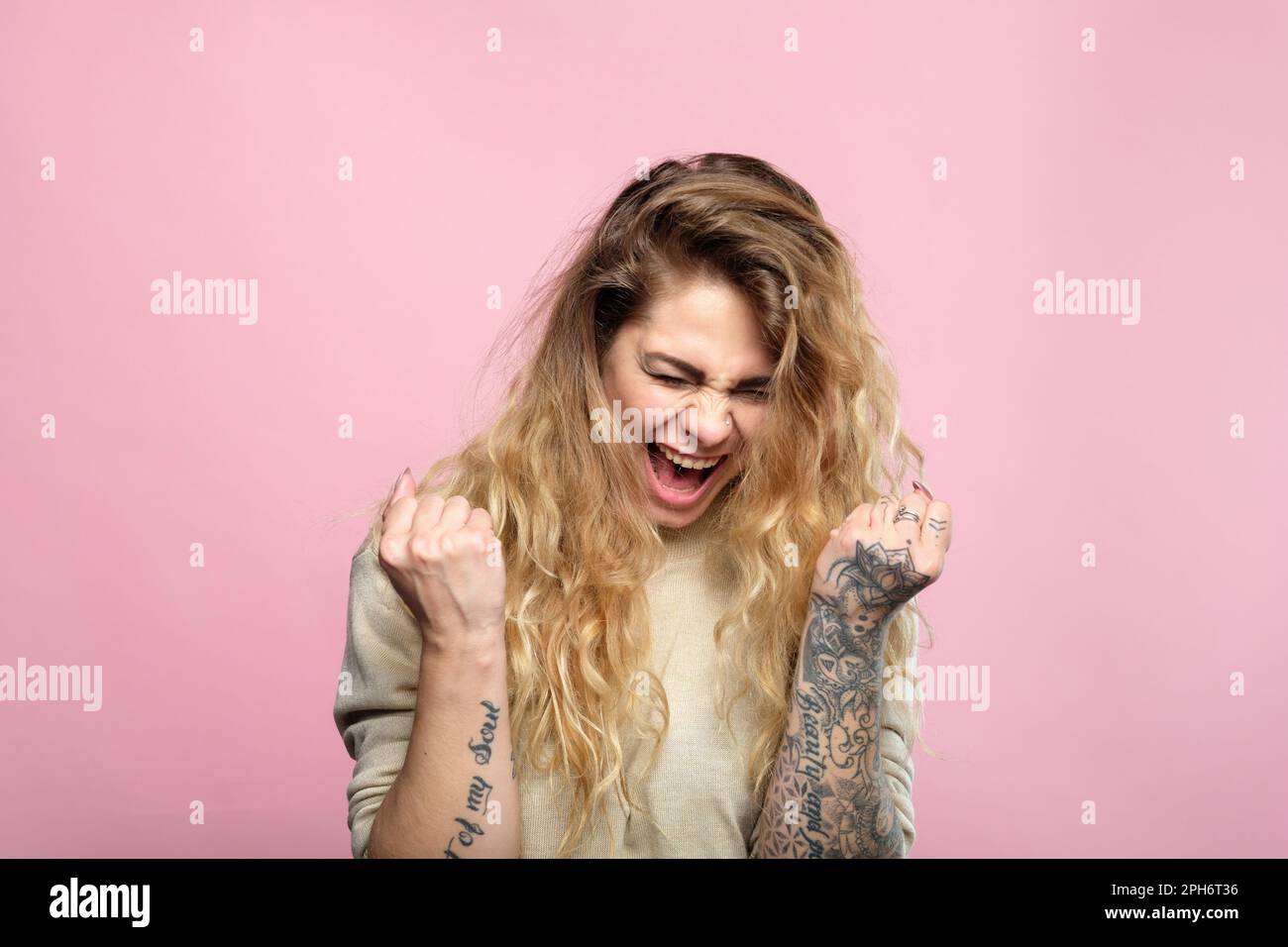 Excited woman win gesture hi-res stock photography and images - Alamy