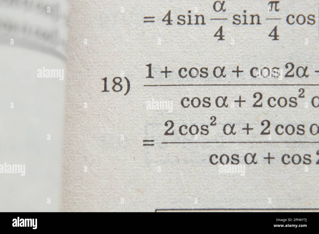 algebra equation on old book page as background, algebra homework Stock Photo