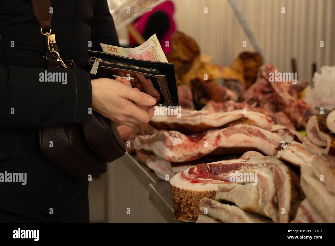 the buyer buys lard at the Ukrainian Bazaar in the city of Dnipro, Ukrainian lard and meat Stock Photo