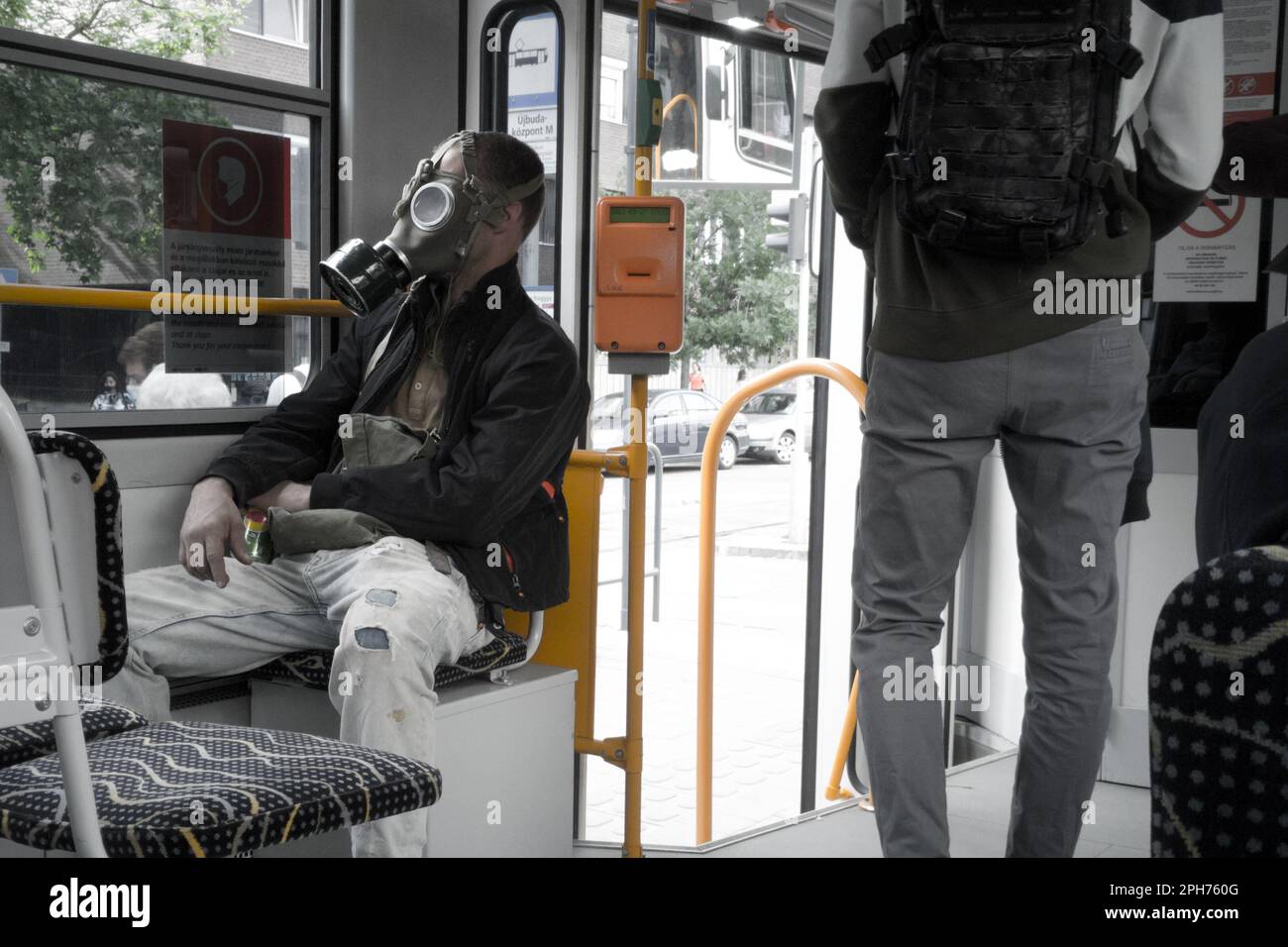 Tram passenger in a military respirator Stock Photo
