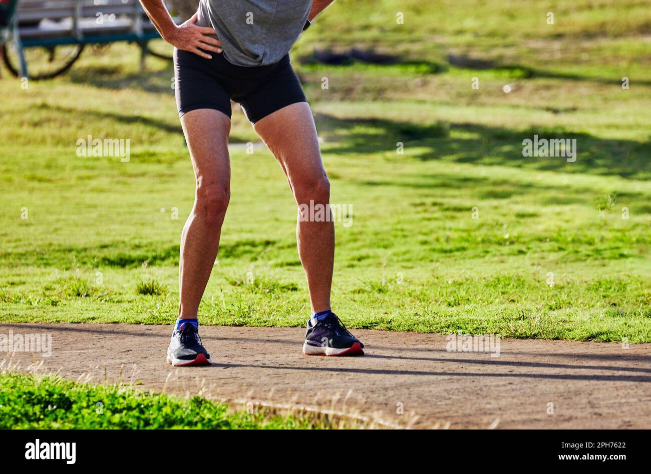 Senior Woman Jogger taking a break Stock Photo