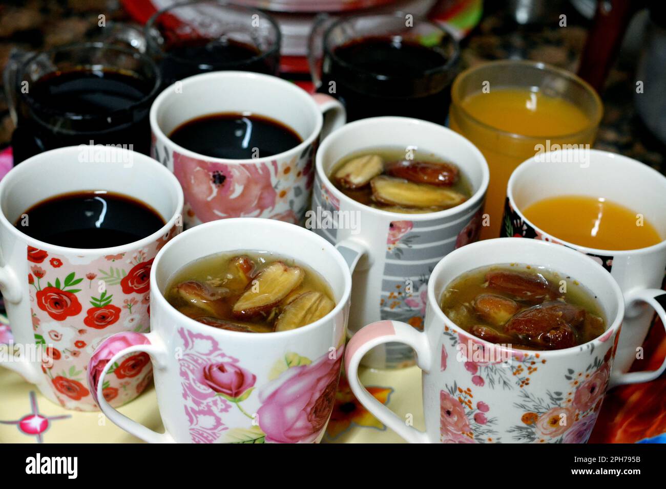 Juices, drinks and compotes tray on the iftar table in Ramadan month with dates, dried fruits