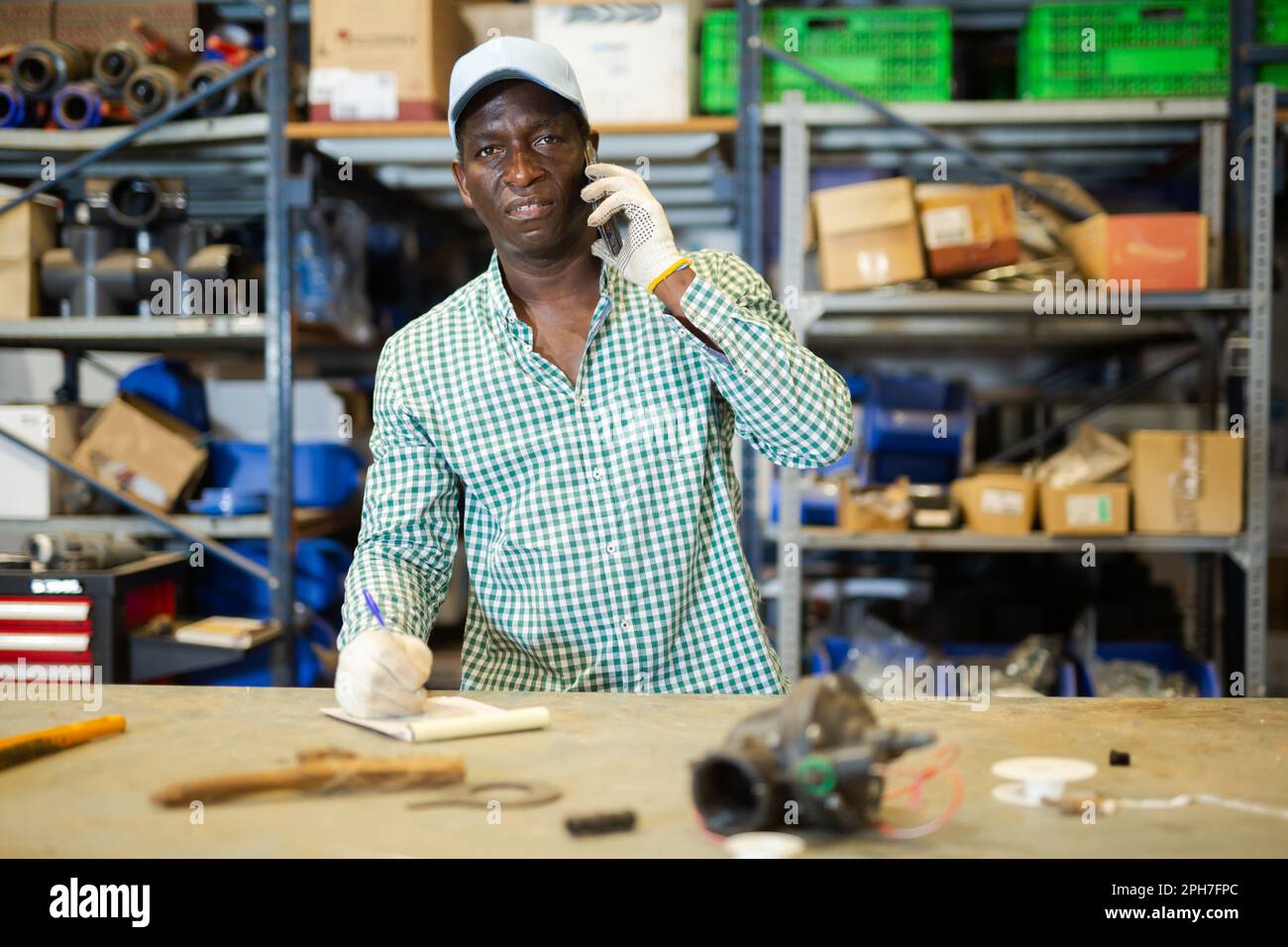 Portrait of African American man confirming order from customer Stock Photo