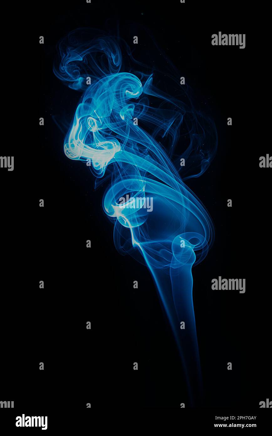 swirl of blue smoke isolated on black background Stock Photo - Alamy