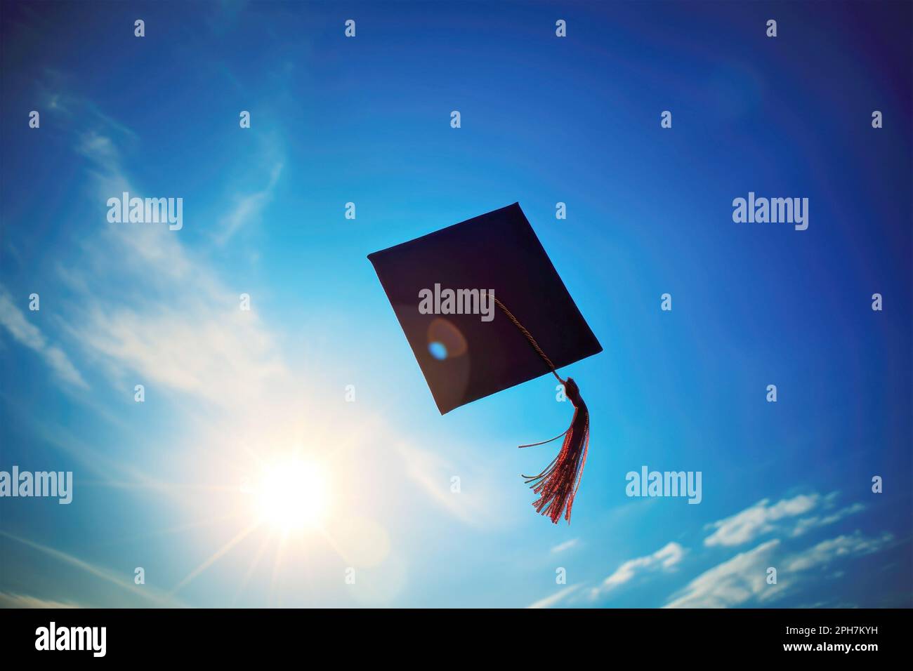Graduation cap thrown into the blue sky. Graduation from an educational