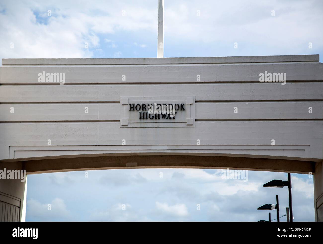 View of the Art Deco concrete abutment portal arch which frame the north end of the Hornibrook Bridge, in Clontarf, Redcliffe Peninsula, Australia Stock Photo