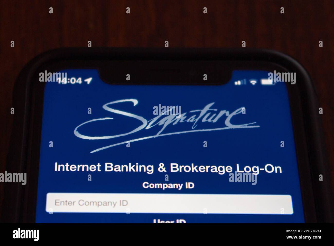 Website of Signature Bank in an iPhone. Signature Bank was an US commercial bank and closed the bank on Mar 12 2023, 2 days after the failure of SVB Stock Photo