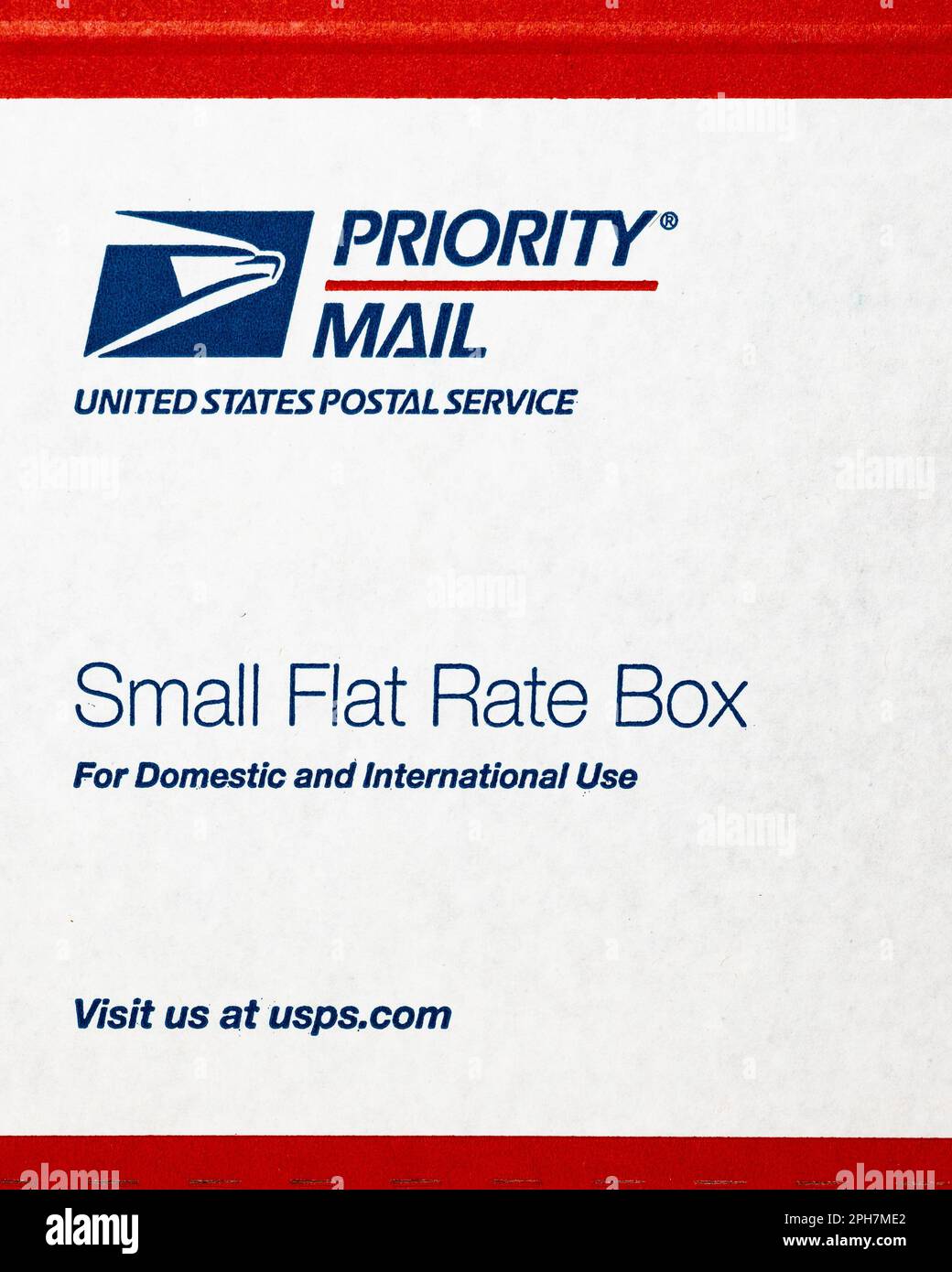 A red white and blue small flat rate box for shipping via United States Postal Service priority mail Stock Photo