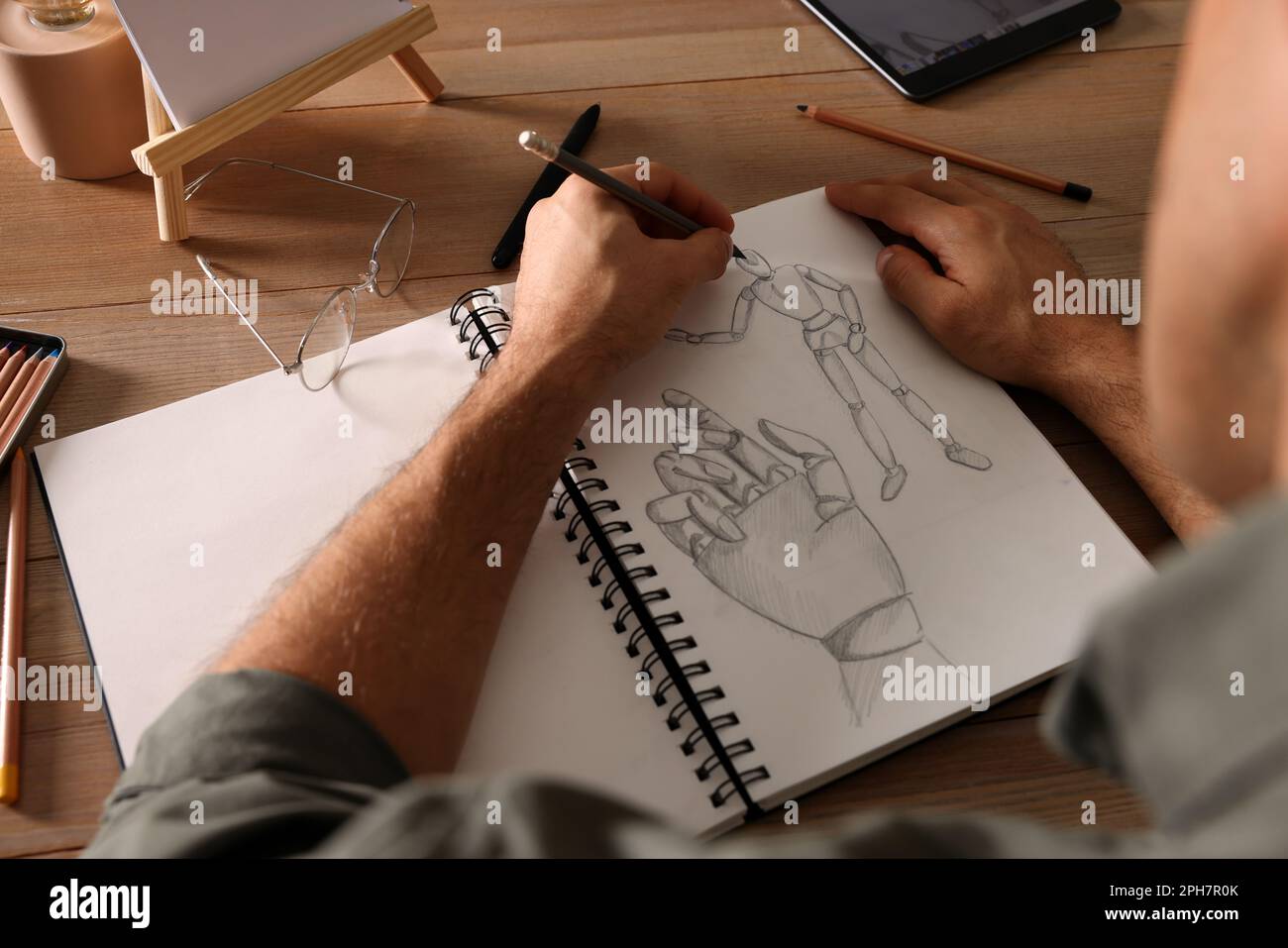 Man Drawing Mannequin Sketchbook Pencil Wooden Table Top View Stock Photo  by ©NewAfrica 556869706