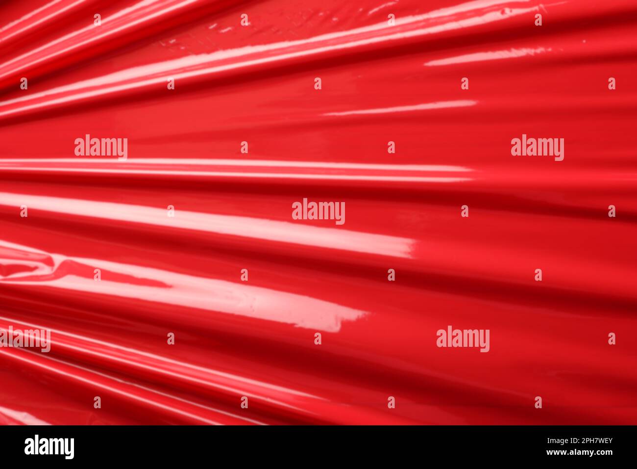 Red plastic stretch wrap as background, closeup Stock Photo Alamy