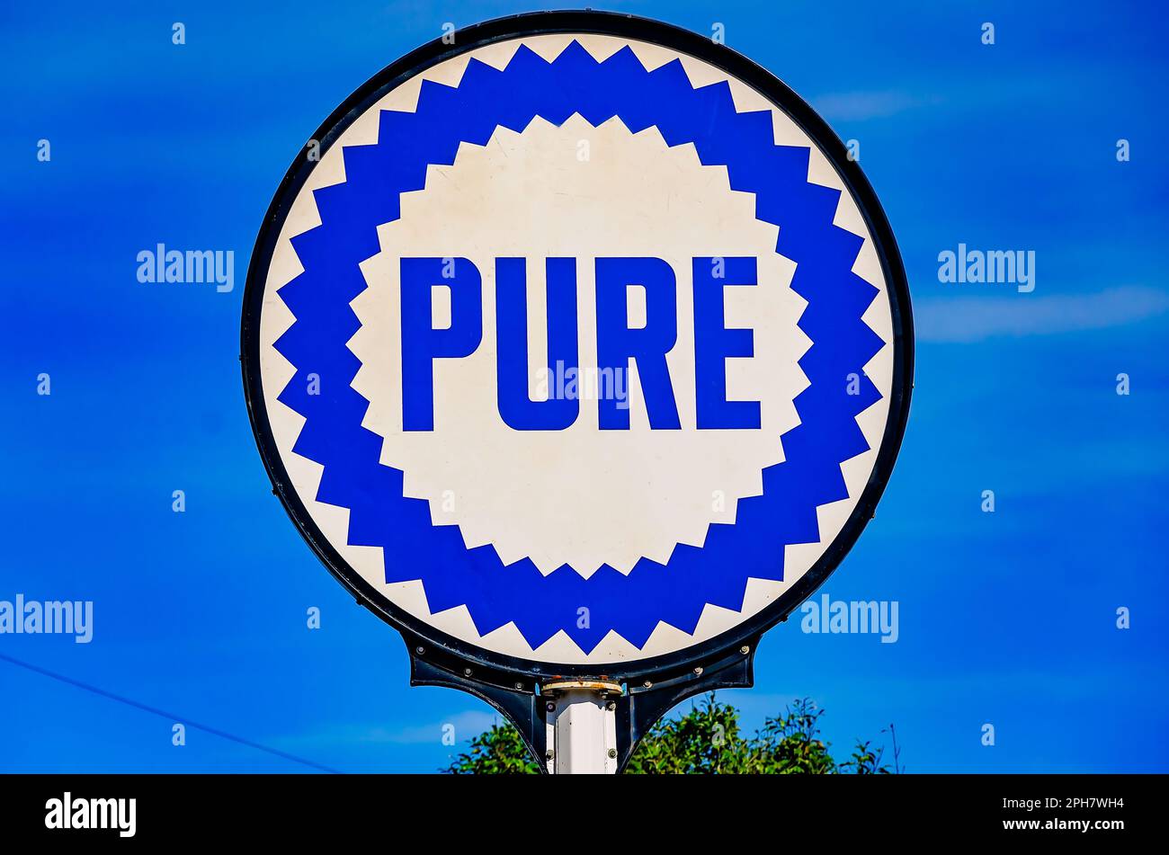 A vintage Pure Oil sign stands in front of Lucedale Chamber of Commerce