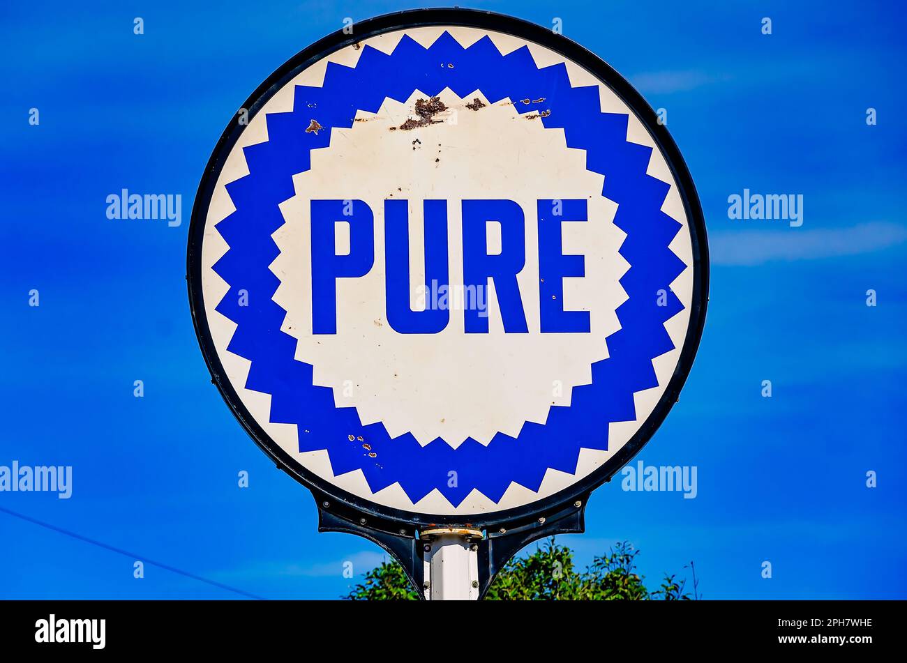 A vintage Pure Oil sign stands in front of Lucedale Chamber of Commerce